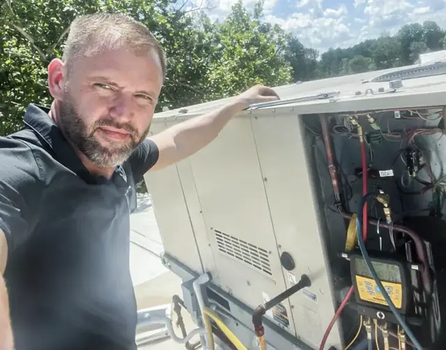 Owner Andy Cody doing a repair.