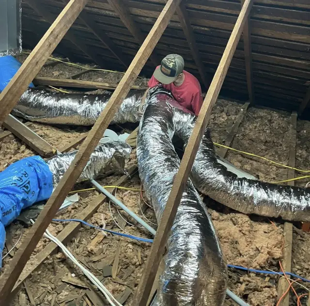 Installing new ductwork in the attic of a customer's home