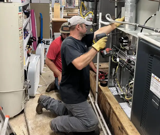 Humphrey AC technicians working on an HVAC repair