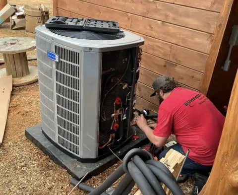 Humphrey AC tech installing a new American Standard HVAC unit.