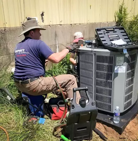 Humphrey Air Conditioning technician provides preventive maintenance on this ac unit.